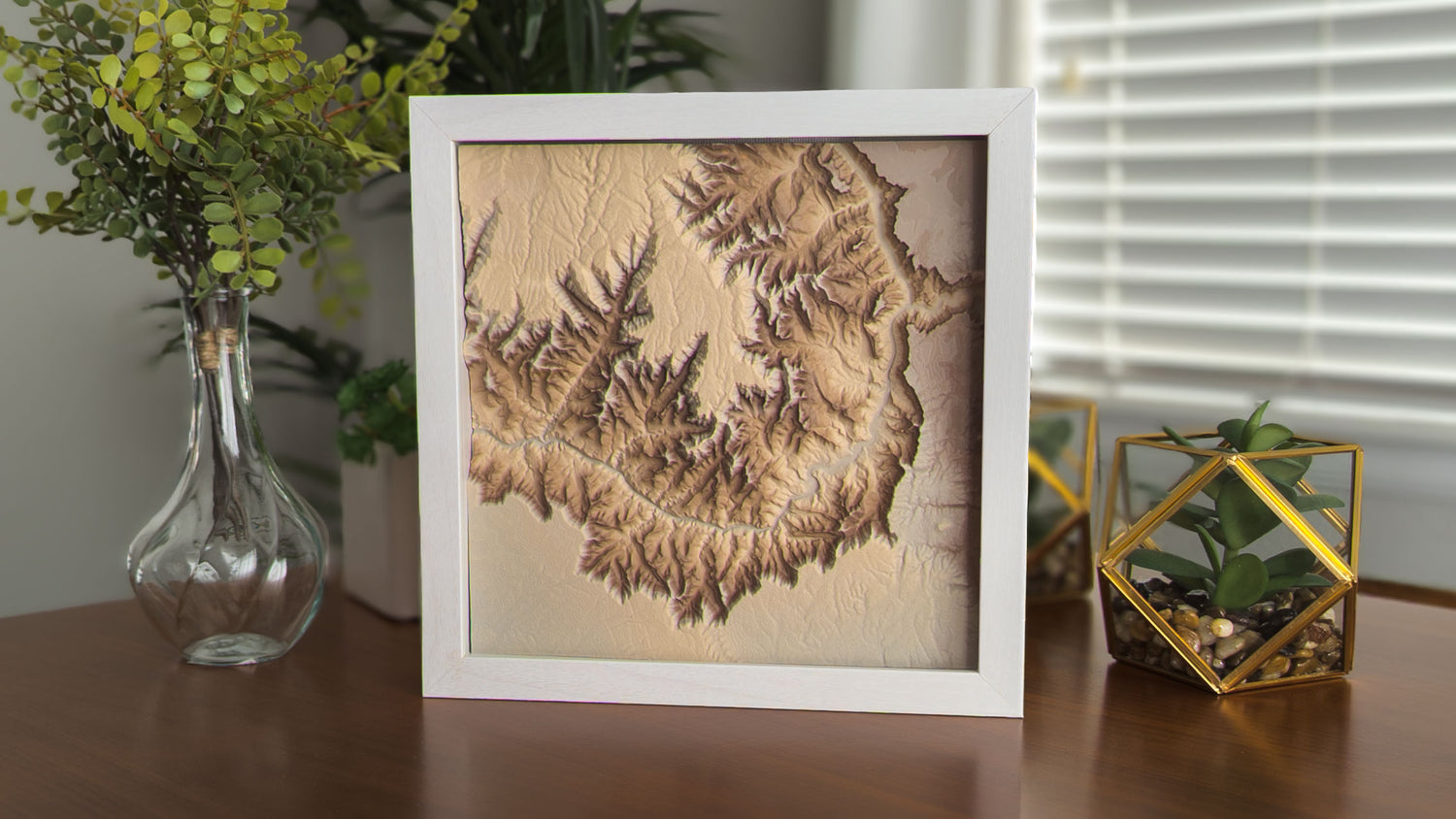 3D topographical print of a section of the Grand Canyon, in mocha with white shadowbox frame